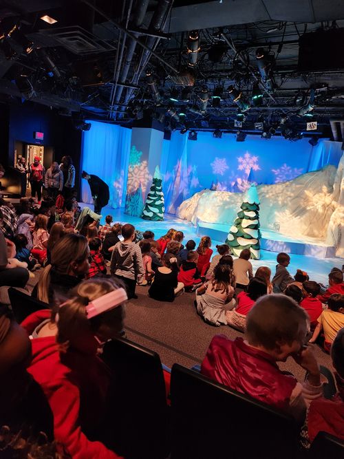 Christmas celebration event on stage.