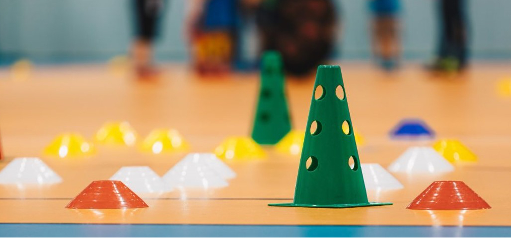 Gym floor with various gaming cones.